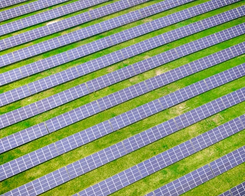 Solar panels installed on a residential roof under blue sky