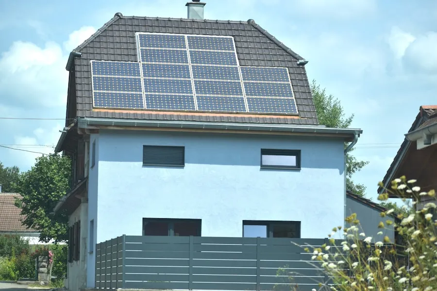 Solar panels mounted on a residential building catching sunlight